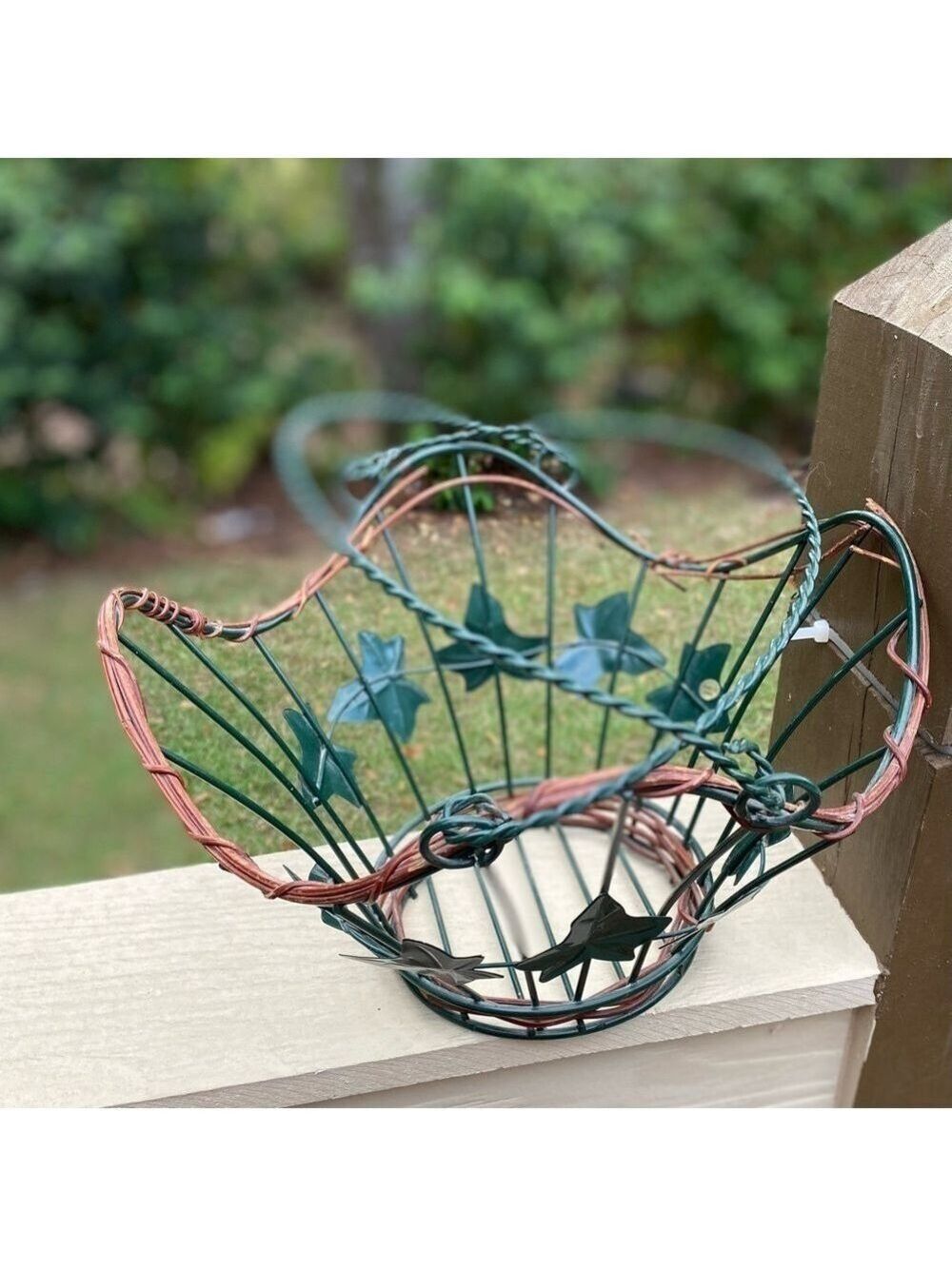 Metal Grapevine Basket. Green metal leaves, wooden grapevine around top & bottom